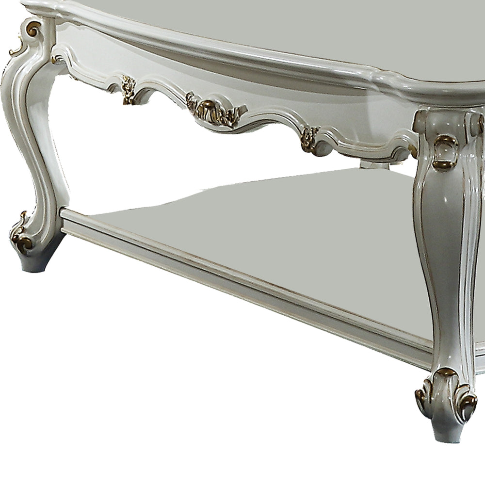 Traditional Style Wooden Coffee Table with Polyresin Carvings and Bottom Shelf, White BM196693
