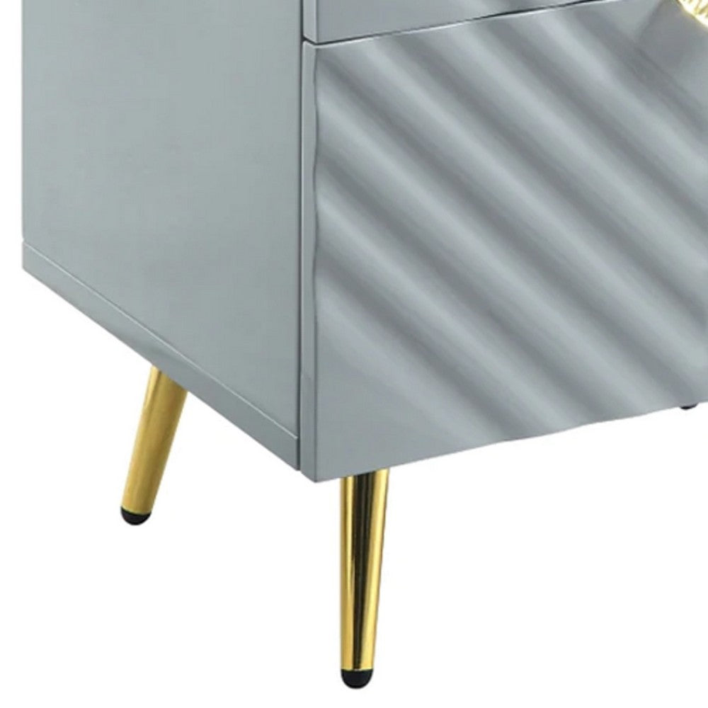 Tyra 25 Inch Wood Nightstand, Textured Wavy Design, Gold Metal Legs, Gray - BM275526