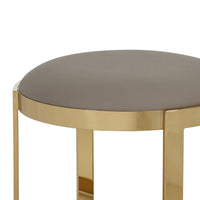 Niyo 19 Inch Ottoman Stool, Round Sand Faux Leather, Stainless Steel, Gold - BM317113