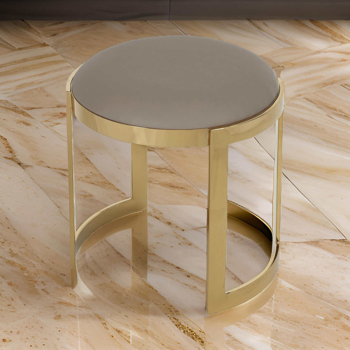 Niyo 19 Inch Ottoman Stool, Round Sand Faux Leather, Stainless Steel, Gold - BM317113