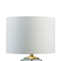 21 Inch Table Lamp, White Drum Shade, Round Clear Glass Base, Brass Metal - BM317487