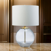 21 Inch Table Lamp, White Drum Shade, Round Clear Glass Base, Brass Metal - BM317487